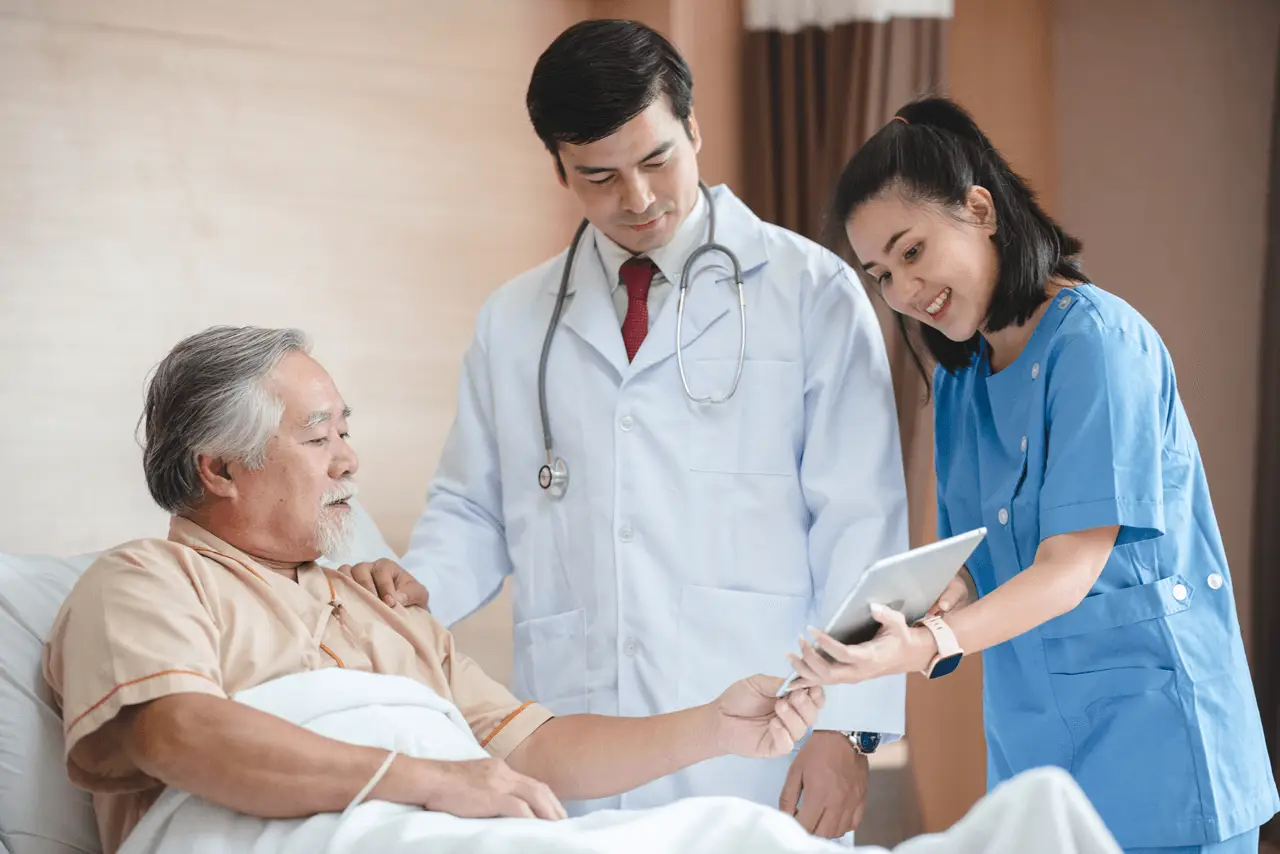 Doctor and nurse providing compassionate care to senior patient at Safe Space Clinic.